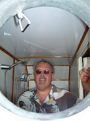 Looking through the porthole in the tiny toilet on the sailing ship Petrina