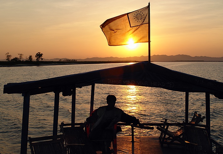 Sunset cruising on Kaladan River to Mrauk U