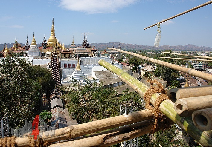 Climbing in the bamboo scaffolding of Giant Buddha in Pyay