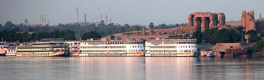 Parked river Nile cruise ships in front of Kom Ombo Temple