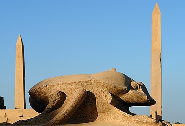 Giant scarab beetle with obelisks in Karnak temple