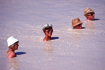 Brave swimmers in the stinking Fango mud bath