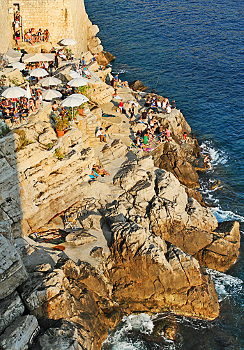Cafe and swimming area (called Buza) in the rocks of the city wall of Dubrovnik