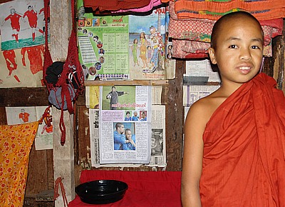 Young monk as football fan in the monastery Shwe Yaunghwe
