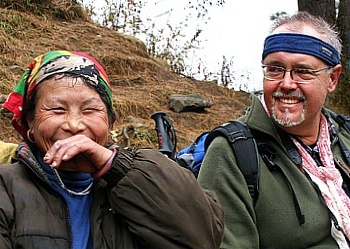 Funny Sherpa woman at a short break on the steep trail up to Namche Bazar