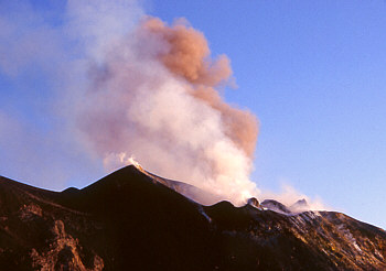 The volcano spews fiery lava boulders