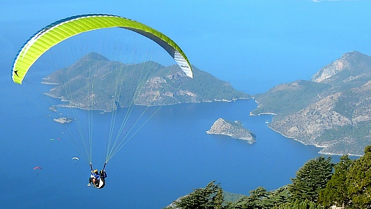Tandem paragliding takeoff from 2000 m high Babadag mountain down to Oludeniz dream beach