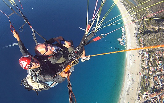 Tandem paragliding from 2000 m high Babadag mountain down to the dream beach of Oludeniz