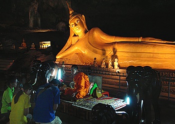 Monk in the Suwan Khuba limestone cave