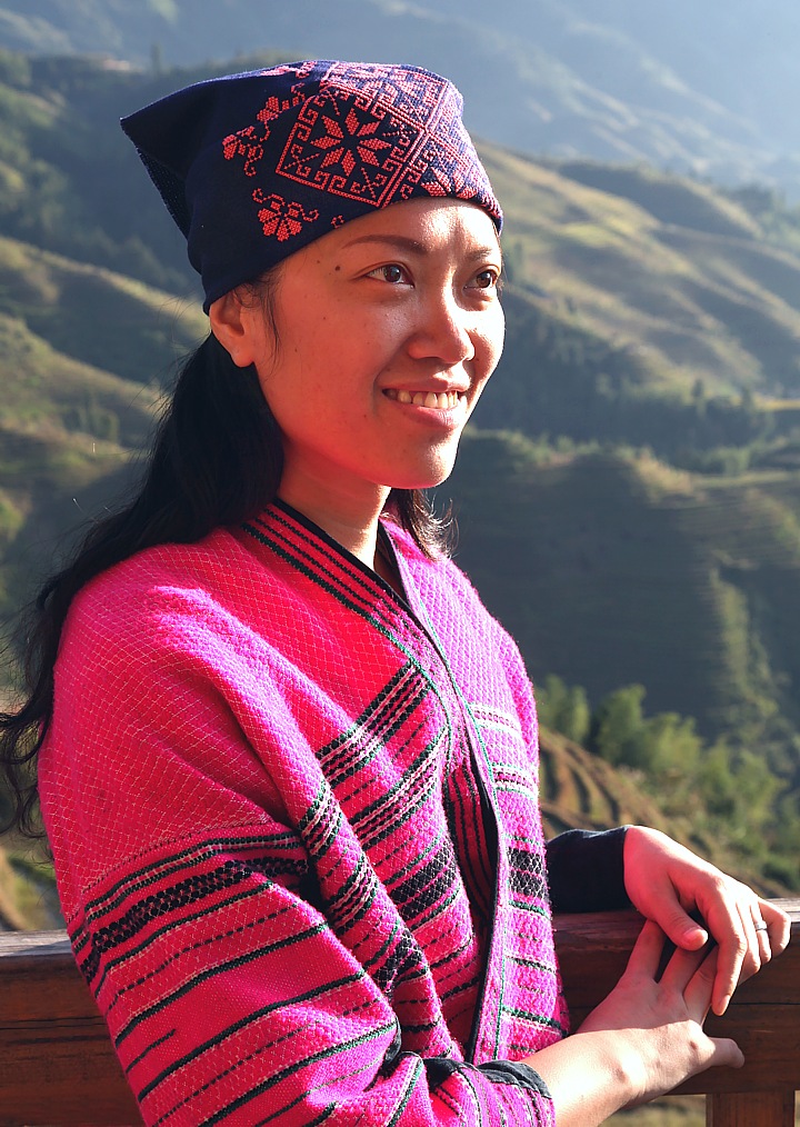 Woman in traditional dress in the rice terraces of Longsheng