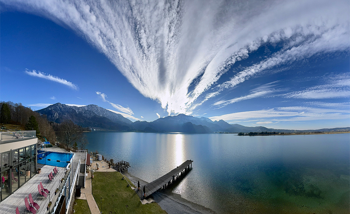 Magic sky and clouds like a volcanic eruption over lake Kochel