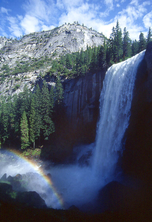 Waterfall with rainbow in Yosemite Park