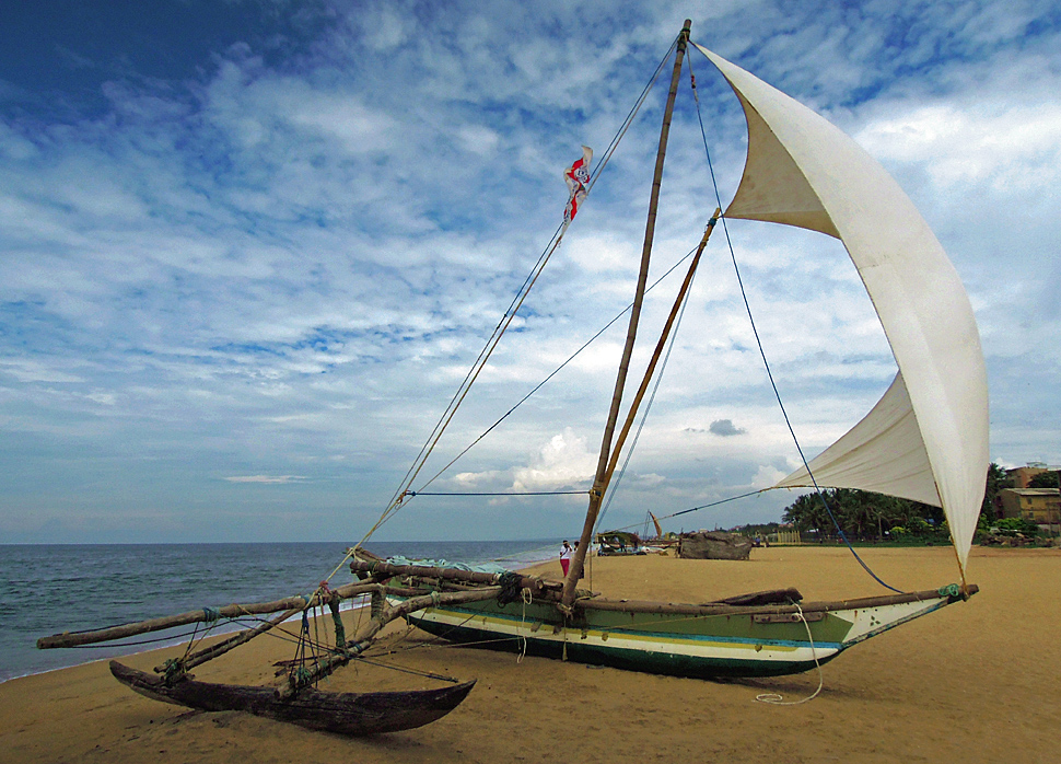 Outrigger fisherboat on the beach of Negombo