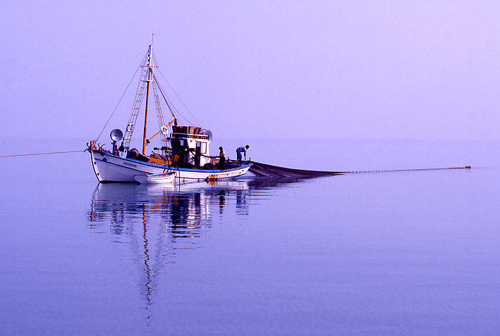 Fisherboat casting fishing net