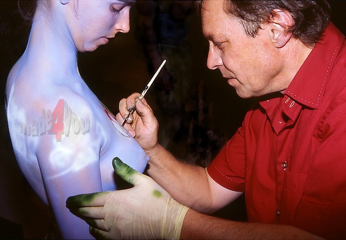 Bodypainting on nude breasts