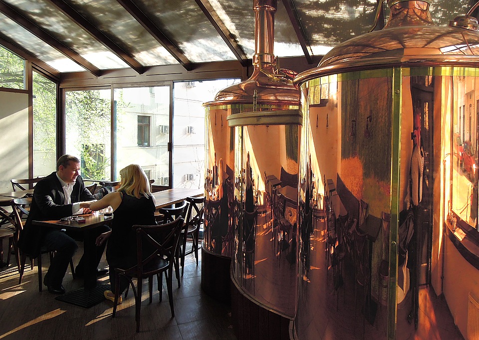 Brewing beer in copper kettle in bar parlor