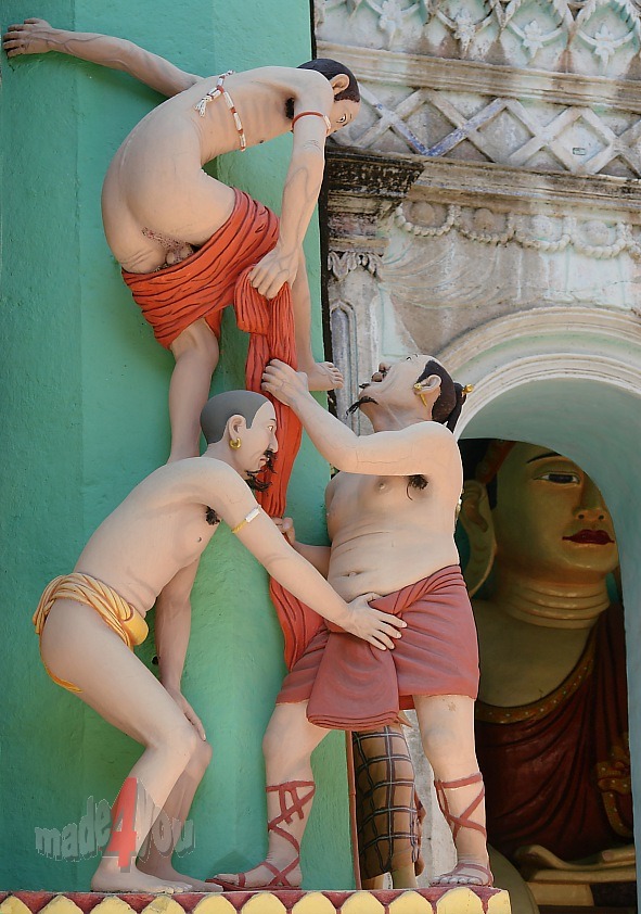 Adult sculptures in Shwebataung under the strict eyes of Buddha