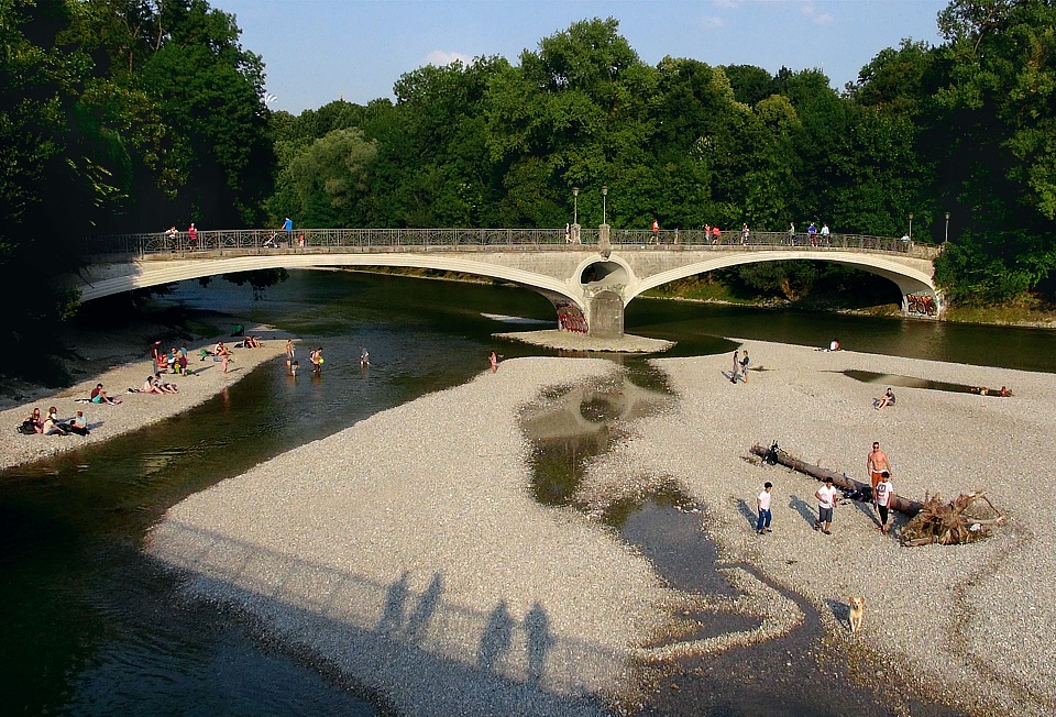 Gravel banks and cable bridge over the river Isar near the Public Baths