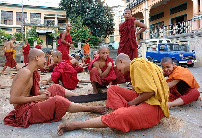 Monks sawing wood in Pyay