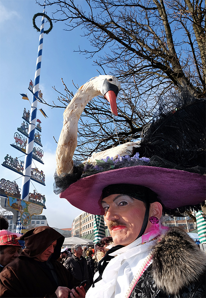 Carnival under bavarian maypole at Viktualienmarket Munich