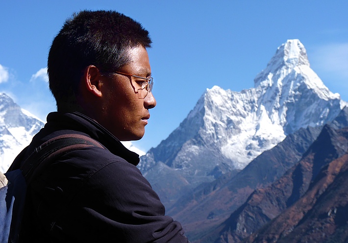 Sherpa in front of the holy mountain Ama Dablam