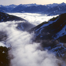 Mountain valley under fog