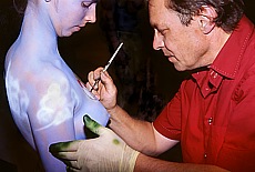 Bodypainting on nude breasts