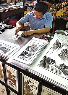 Chinese painter at work