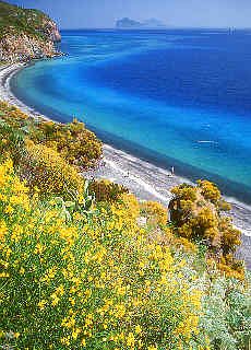 Spiaggia Bianca beach in Canneto, in the background the Aeolian Islands Panarea and Stromboli