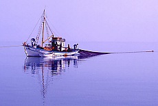 Fisherboat casting fishing net