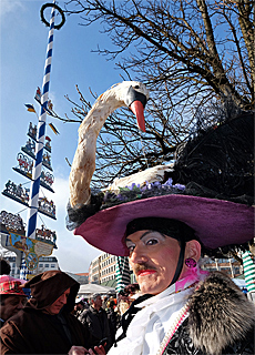 Carnival under bavarian maypole at Viktualienmarket Munich