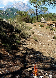 Flaming rocks Yanartas with view to Tahtali Dagi