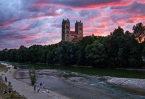 Fantastic pink Sunset on river Isar near St. Maximilian Church