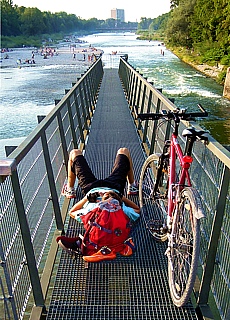 Relaxing on the Marien bridge over river Isar