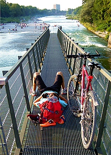 Mountainbike Relaxing on the Marienbridge at river Isar