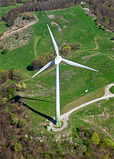 Wind turbine on top of the mountain of rubble