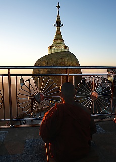 Monk praying at Golden Rock Kyaikhto