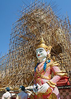 Climbing in the bamboo scaffolding of Giant Buddha in Pyay