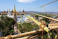 Climbing in the bamboo scaffolding of Giant Buddha in Pyay