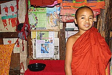 Young monk as football fan