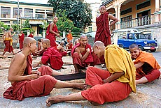 Monks sawing wood in Pyay