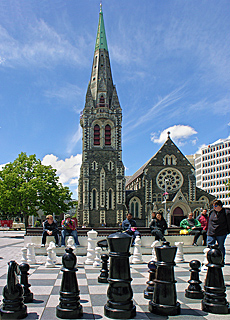 Chess player in front of Christchurch Cathedral