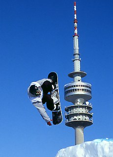Snowboard Akrobatik in front of Olympiatower Munich