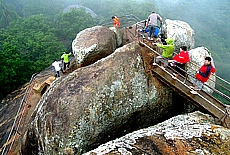 Climbing up Mihintale rock in heavy rain