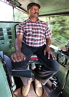 Locomotive engineer on the diesel locomotive in Sri Lanka