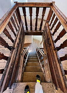 Wooden staircase in the white tower