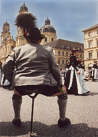 Performer in traditional bavarian costume at Odeonsplatz
